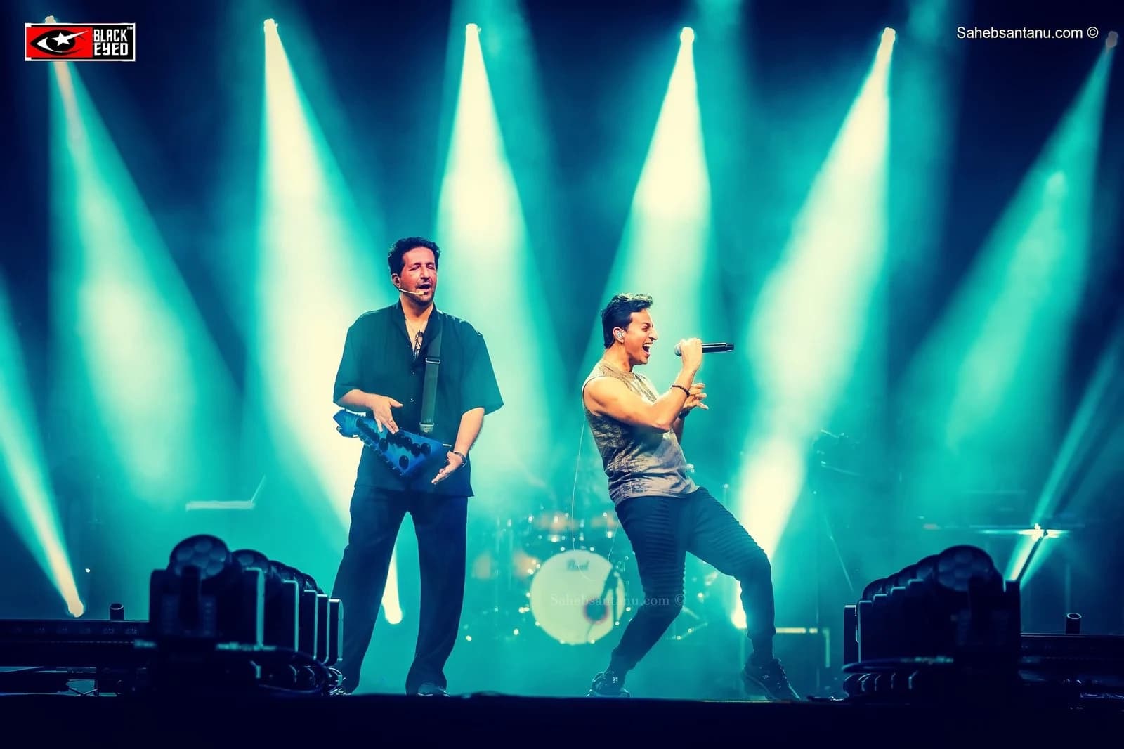 Two artists sharing a BlackEyed stage under green lights